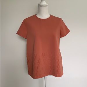 COS orange blouse with cutout